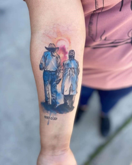 Arm with grandparents tattoo