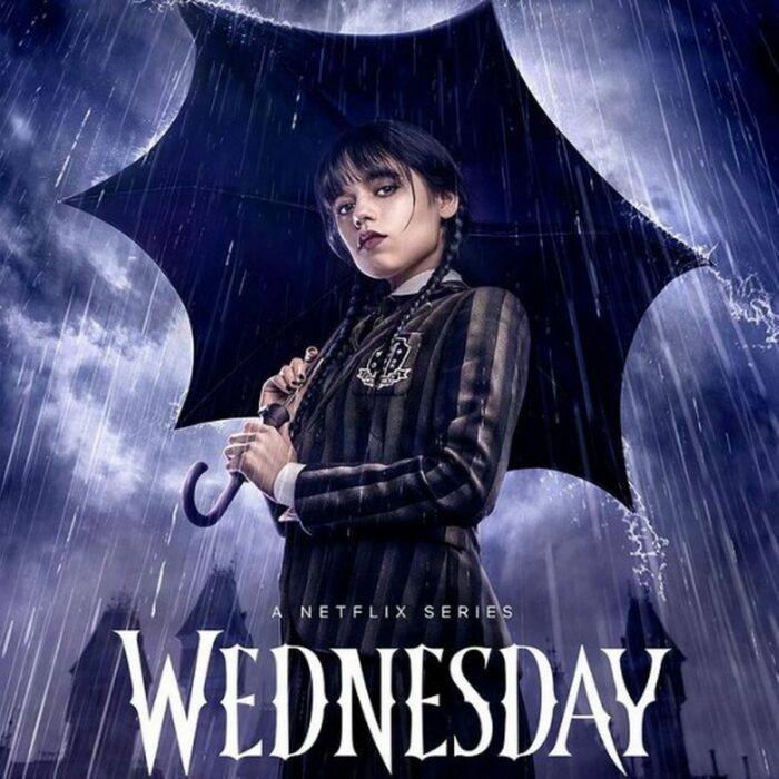 Jenna Ortega holding an umbrella as Merlina on the cover of the Netflix series