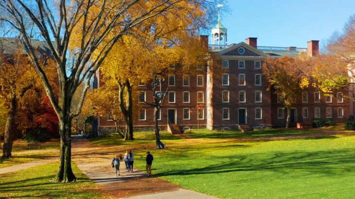 facade of a university in the United States located in large gardens 