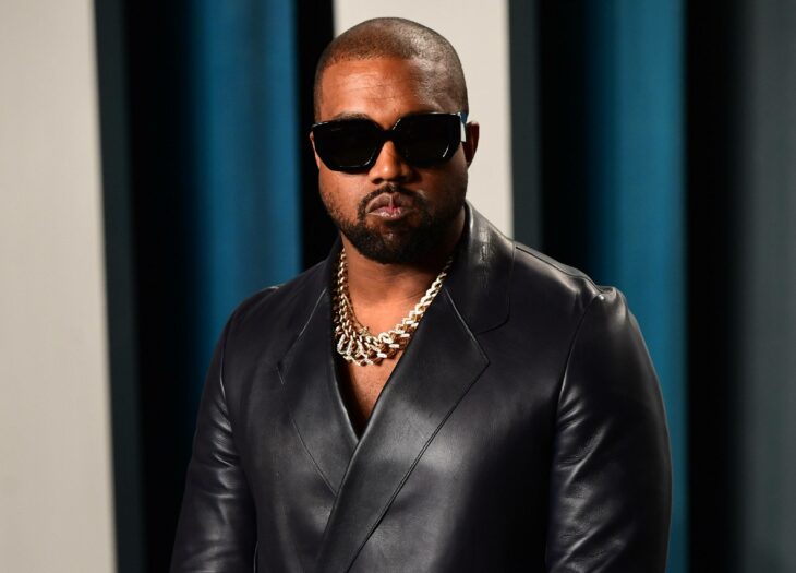 The American rapper posing in a black leather jacket with dark glasses 