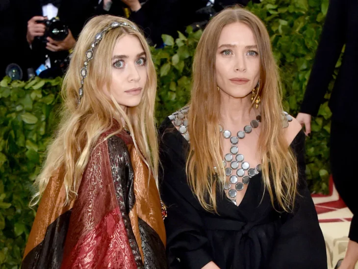 The Olsen twins on a red carpet wear evening dresses