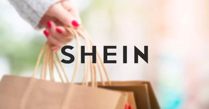 image of the Shein brand on the hands of a girl who carries bags