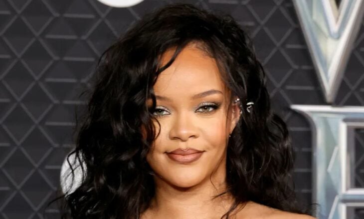 Rihanna in a close-up has her hair loose tousled