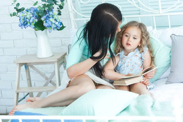 mother and daughter reading