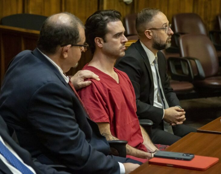 Phill Reitzenstein touching Pablo Lyle's shoulder during his trial in Florida court