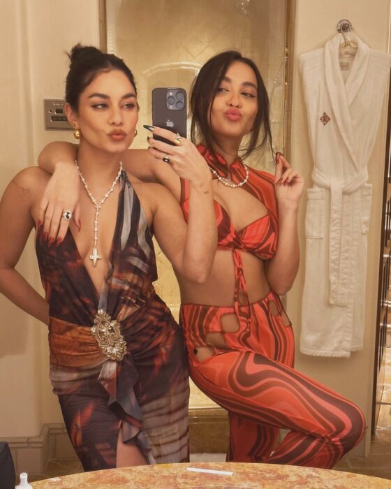 Vanessa Hudgens with her sister Stella posing in a hotel bathroom 