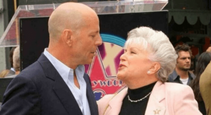 Bruce Willis poses at an event with his mother Marlene