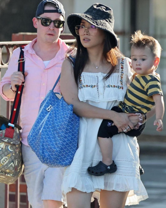 Macaulay Culkin and Brenda Song accompanied by their little son on a walk through the streets