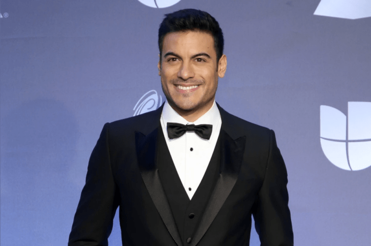 Carlos Rivera in a black tuxedo at a Univision event