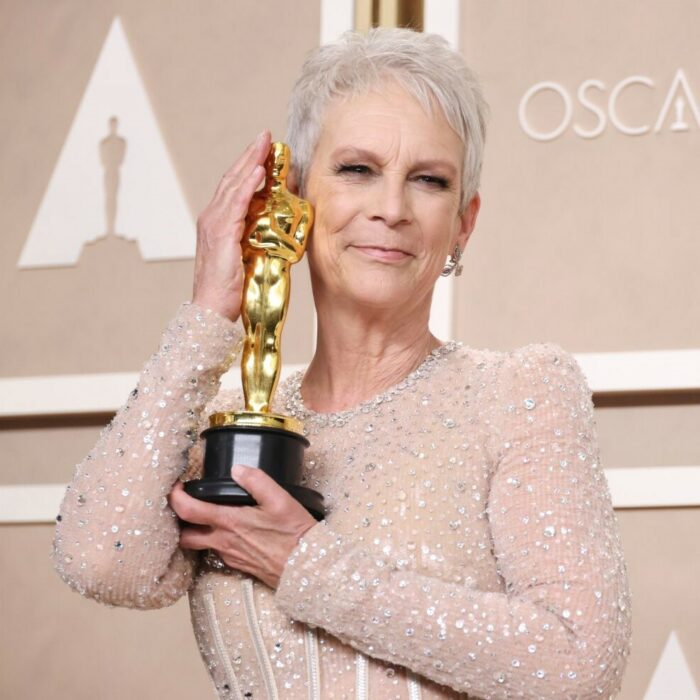 Jamie Lee Curtis carrying her Oscar for Best Supporting Actress