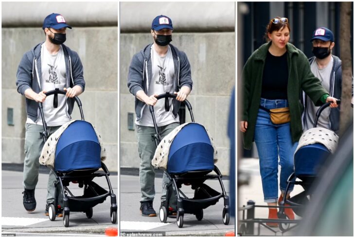 Daniel Radcliffe and Erin walking their son