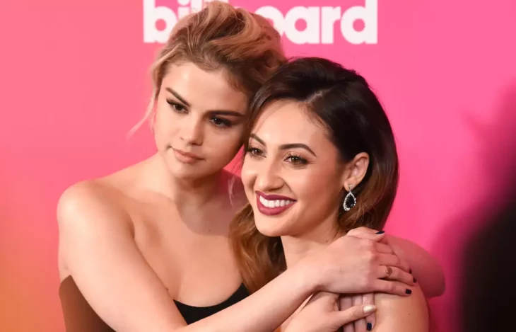 Selena Gomez and Francia Raisa embrace on a red carpet