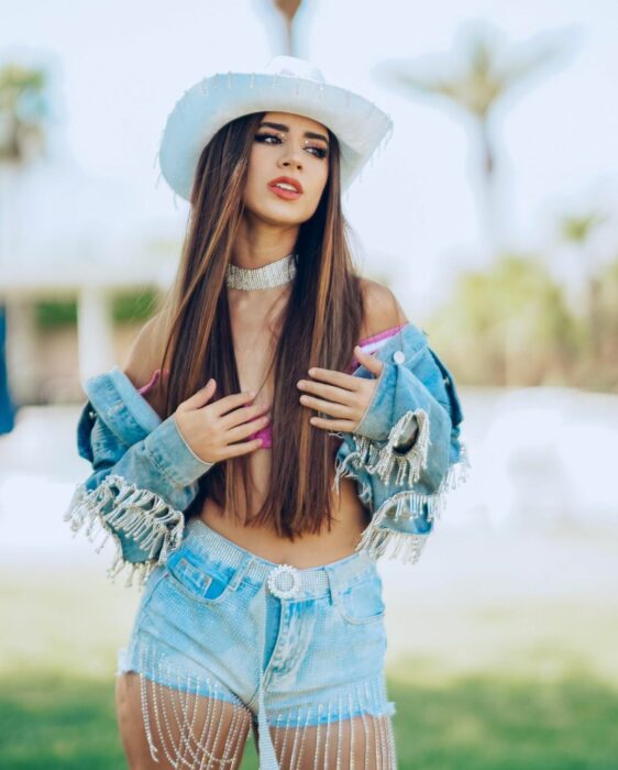 Tammy Parra with a hat in a garden 