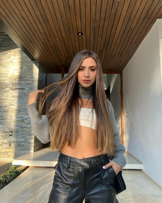 Tammy Parra at the entrance of a house 