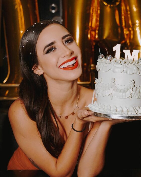 Tammy Parra with a cake 